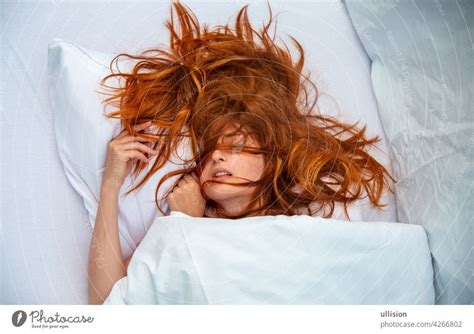 Attractive Young Sexy Red Haired Woman Redhead Hair Wild On The Sheets Mouth Open Lying