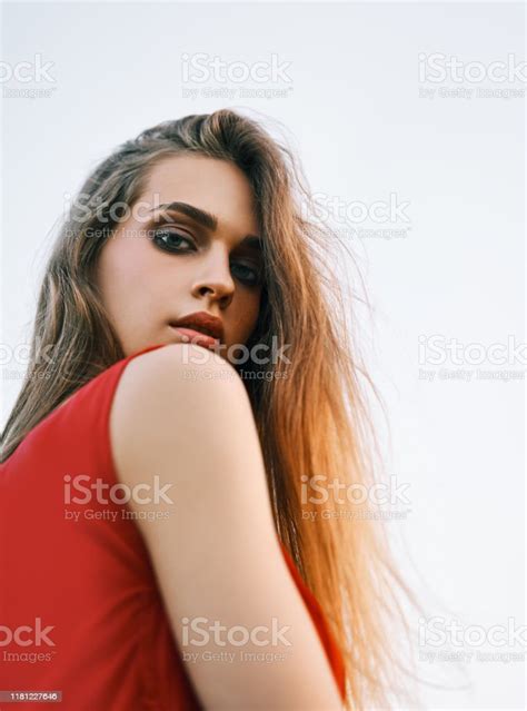 Portrait Of Beautiful Young Woman Posing Outdoors In Summer Sun Stock