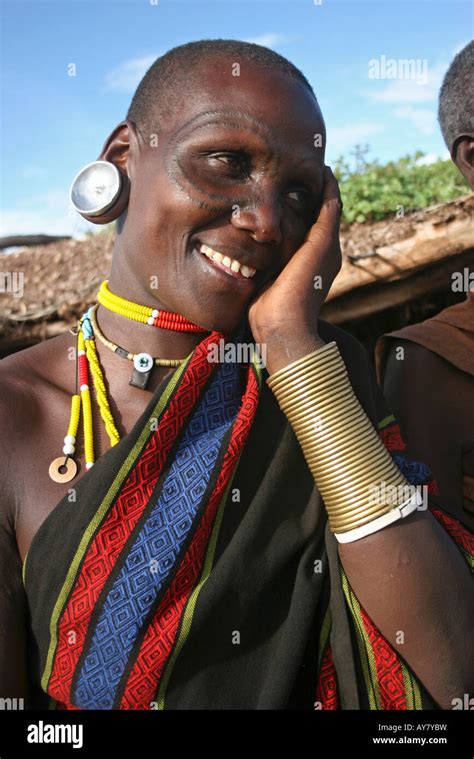 Africa Tanzania Members Of The Datoga Tribe Woman In Traditional Dress Beads And Earrings Beauty