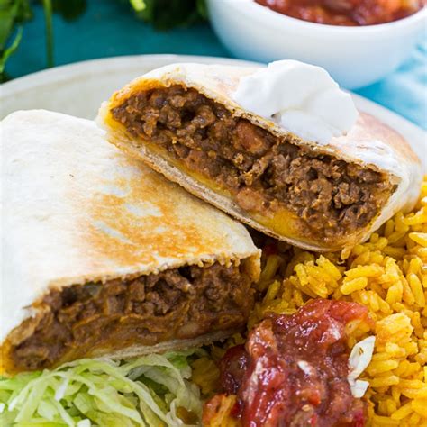 Hearty and filling with just the right amount of spice, this bean, sausage and beef burrito recipe is easy, fast, bold and comforting. Beef and Bean Burritos - Spicy Southern Kitchen