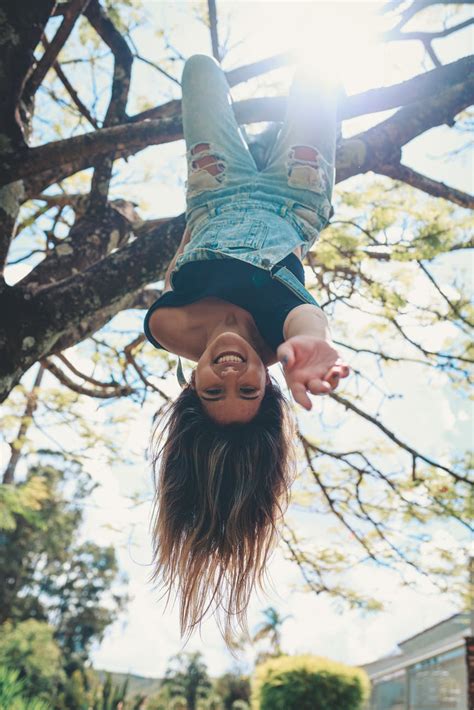 Photo Of Woman Hanging On The Tree Upside Down · Free Stock Photo