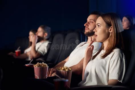 caucasian couple watching horror movie in movie theater stock image image of screen people