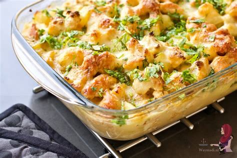 A Casserole Dish With Potatoes And Parsley