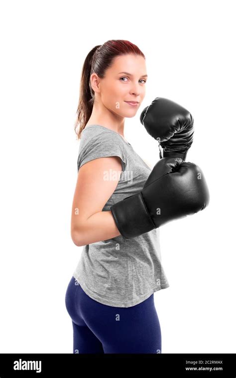 Portrait Of A Beautiful Young Woman With Boxing Gloves In A Stance With