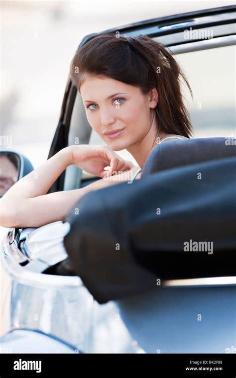 Woman Leaning Out Of Car Window Stock Photo Alamy
