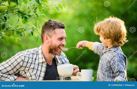 father and son eat outdoor they love eating together weekend breakfast organic and natural