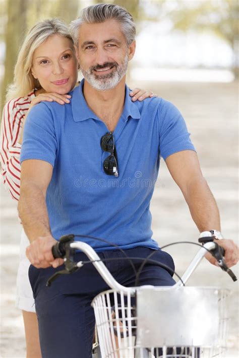 Happy Mature Couple Having Fun On Bike Stock Image Image Of Bikes Cheerful 205858203