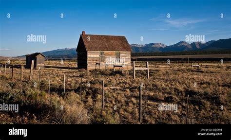 Abandoned Old Historic Farmhouse And Outhouse In Colorado USA Country