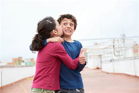 Sister Kissing Her Brother By Stocksy Contributor Guille Faingold