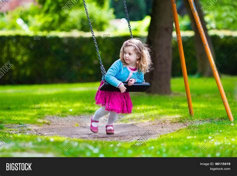 Little Girl On Swing Image And Photo Free Trial Bigstock