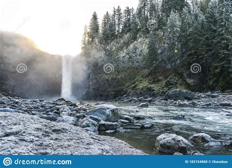 Scenic View Of Snoqualmie Falls With Golden Fog When