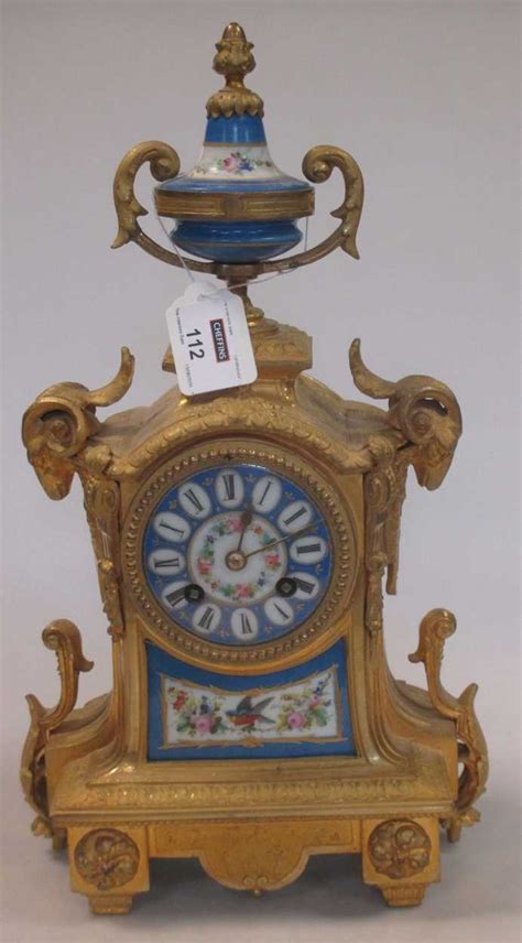 A Late 19th Century French Gilt Metal And Porcelain Mounted Mantel