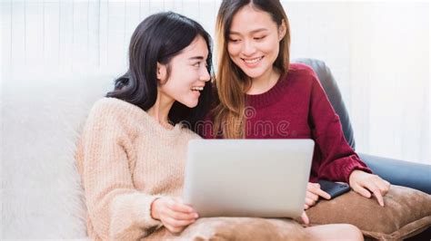 Young Beautiful Asian Women Lesbian Couple Lover Using Smartphone And