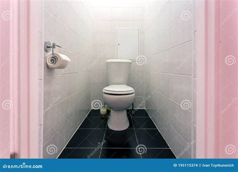 White Ceramic Toilet Bowl In Restroom Stock Photo Image Of Towel Pipes