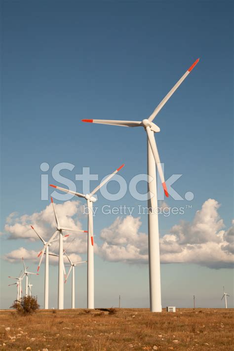 Wind Turbine Farm Over The Blue Clouded Sky Stock Photo Royalty Free