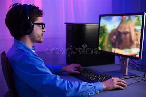 Gamer Playing Games Sitting At Pc At Home At Night Stock Image Image