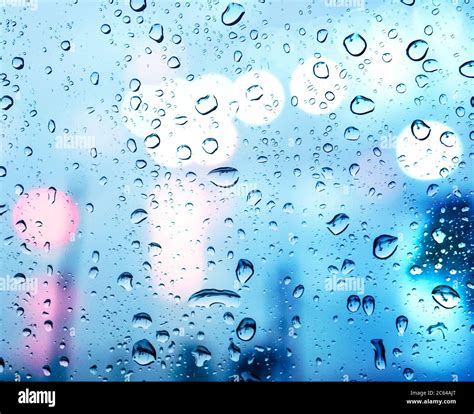 Water Drops On Glass Window With Bokeh Lights Stock Photo Alamy
