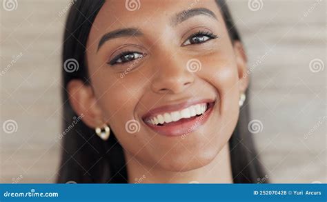Closeup Portrait Of A Happy And Confident Female Smiling With Perfect