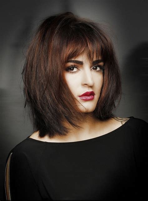 Sleek long layered hairstyle with bangs. Hairstyles for round faces - inspiring ideas for women of ...