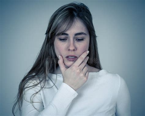 Portrait Of Sad And Intimidated Woman Isolated In White Background