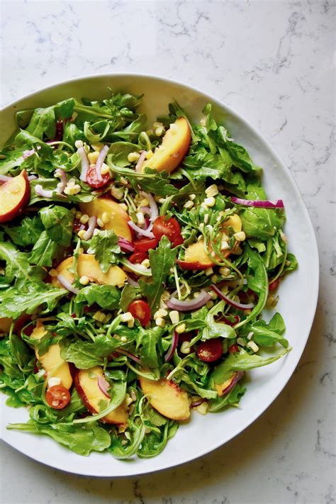 This main dish salad recipe screams summer. Summer Arugula Salad with Peaches and Corn