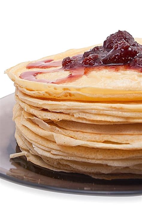 Big Stack Of Pancakes With Strawberry Jam Isolated On White Stock Photo