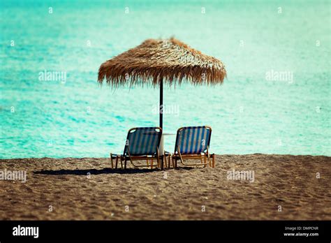 Beach Sun Beds And Straw Umbrella On The Beach Stock Photo Alamy