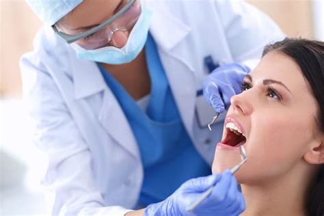 43397789 Woman Dentist Working At Her Patients Teeth The Smart Choice