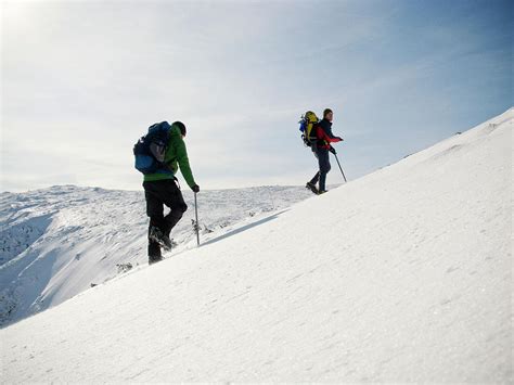 Two Mountain Climbers Ascend The Summit Photograph By Chris Bennett