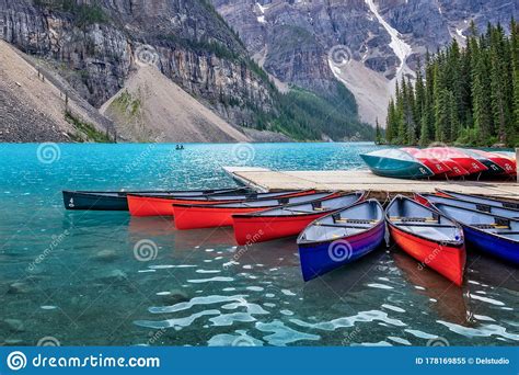 Corlorful Canoes On Moraine Lake Near Lake Louise Village In Banff