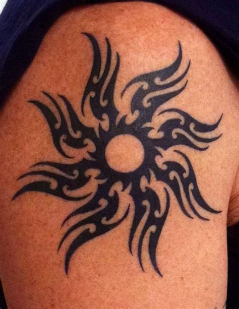 Black Tribal Sun Tattoo On Shoulder Tattoomagz Tattoo Designs