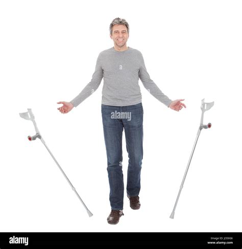Senior Man Walking Using Crutches Isolated On White Stock Photo Alamy