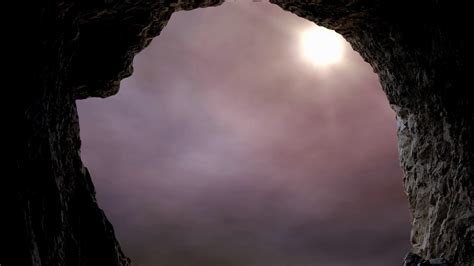 Looking Out A Cave Entrance As The Sun Shines Into The Tomb Against A
