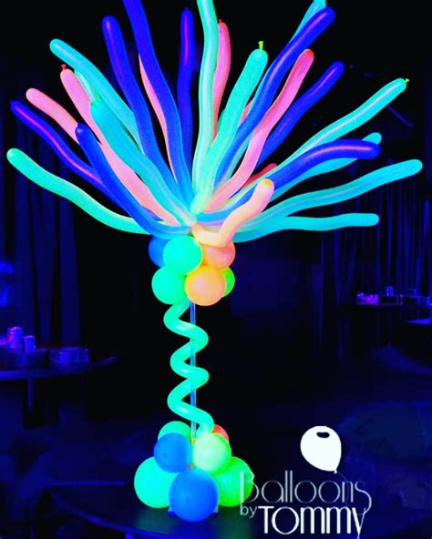 Uv Reactive Balloons Make This Centerpiece Glow Balloons By Tommy