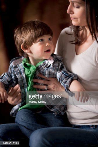 Mom Holding Her Toddler Son On Her Lap High Res Stock Photo Getty Images