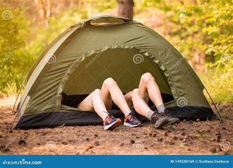 Young Couple Lying In Tent With Feet View From Outside Stock Image Image Of Activity Girl