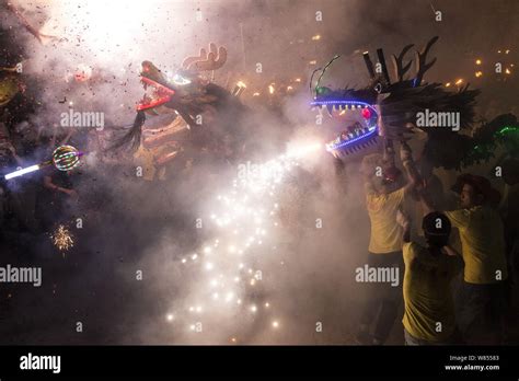 Chinese Entertainers Perform A Fire Dragon Dance To Celebrate The Mid