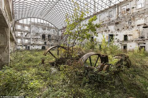 abandoned buildings around the world now teeming with plant life after being reclaimed by nature