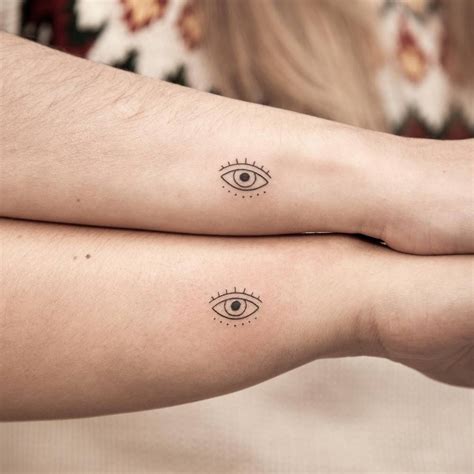 Matching Minimalistic Evil Eye Tattoo For Sisters
