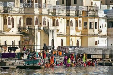 women bathing in the ahar river in the city of udaipur city of news photo getty images