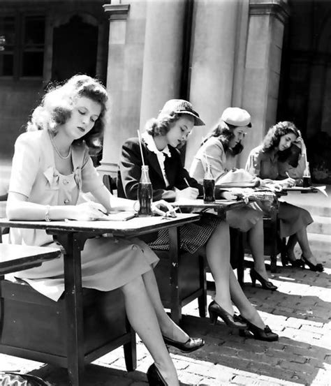 A Group Of 1940s Female Students Doing Their Schoolwork Outdoors