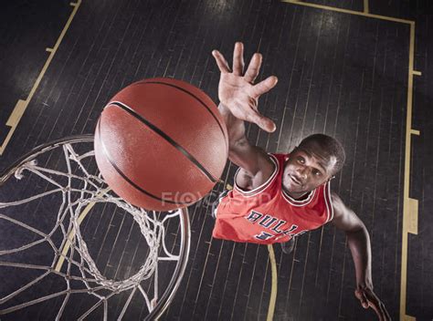 Overhead View Young Male Basketball Player Jumping To Rebound The Ball