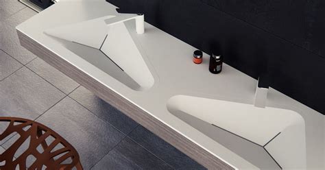 This sink faucet exemplifies the purist collection's understated style, with its low spout and lever handles. The Monolit Bathroom Sink By Le Projet Was Inspired By ...