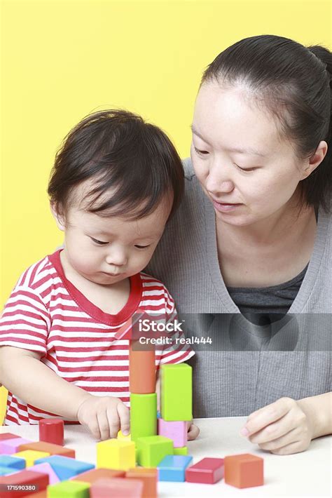 Happy Asian Mother And Son Playing With Blocks Stock Photo Download