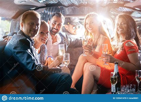 Group Of Party People In A Limo Drinking Stock Photo Image Of Elegant Caucasian