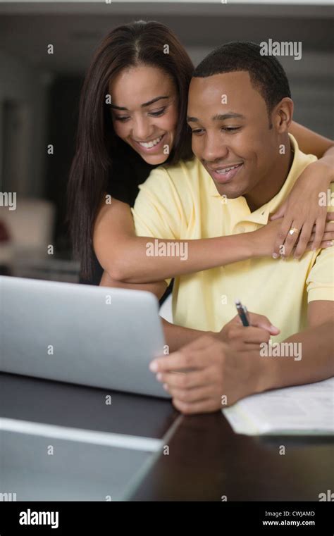 Mixed Race Couple Using Laptop Stock Photo Alamy