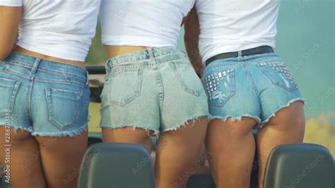 Three Sexy Girls In Denim Shorts Move Their Buttocks Dancing Ass In Jeans Stock Video Adobe