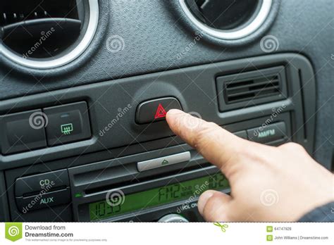 I pull out same button from junkyard, i plug it in and. Man Hand Pressing Car Hazard Lights Button Stock Photo ...