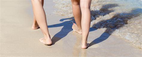 Legs Of Women Walking On The Sand At Sunset Stock Photo Image Of
