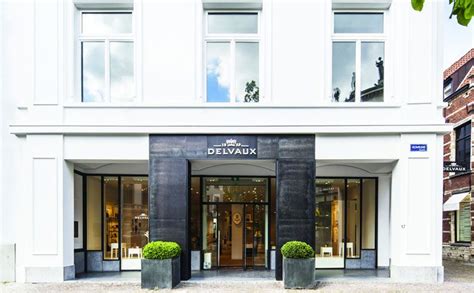 The Entrance To Delvaux Boutique In Front Of A Large White Building